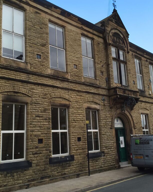 Victorian commercial building with traditional sash windows in stone facade